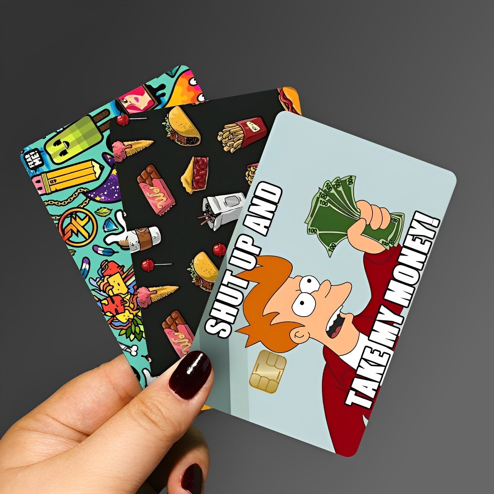 a hand holding a card with a cartoon character on it