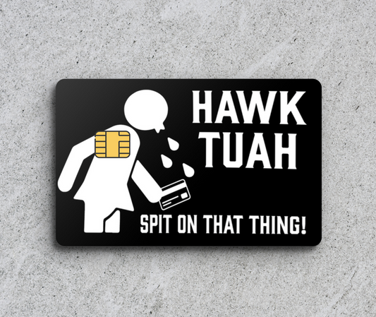 a sticker on a wall that says hawk tuah spit on that thing